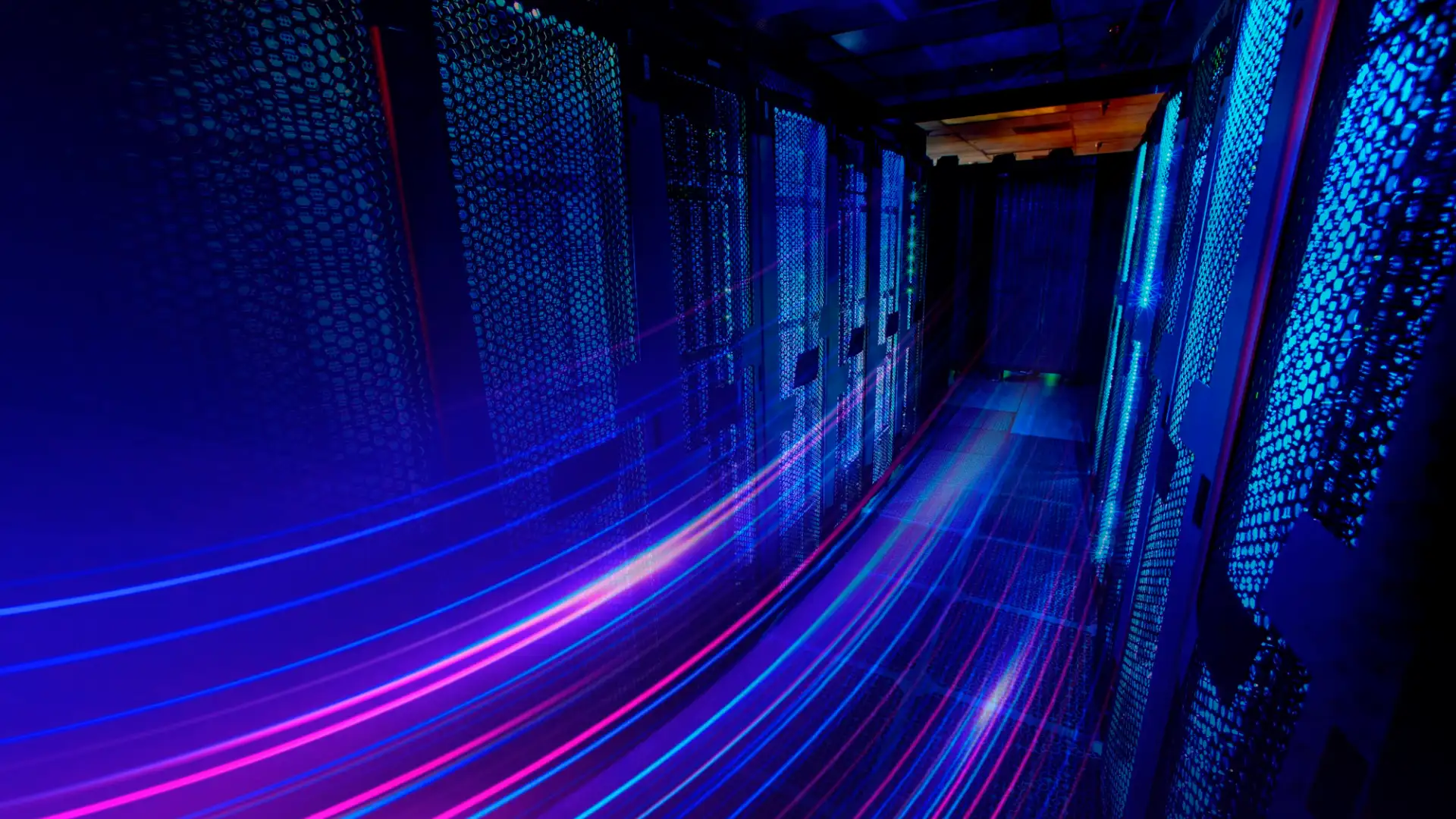 Dark data center aisle lined with illuminated blue server racks and dynamic magenta light streaks representing high-speed network data transfer.