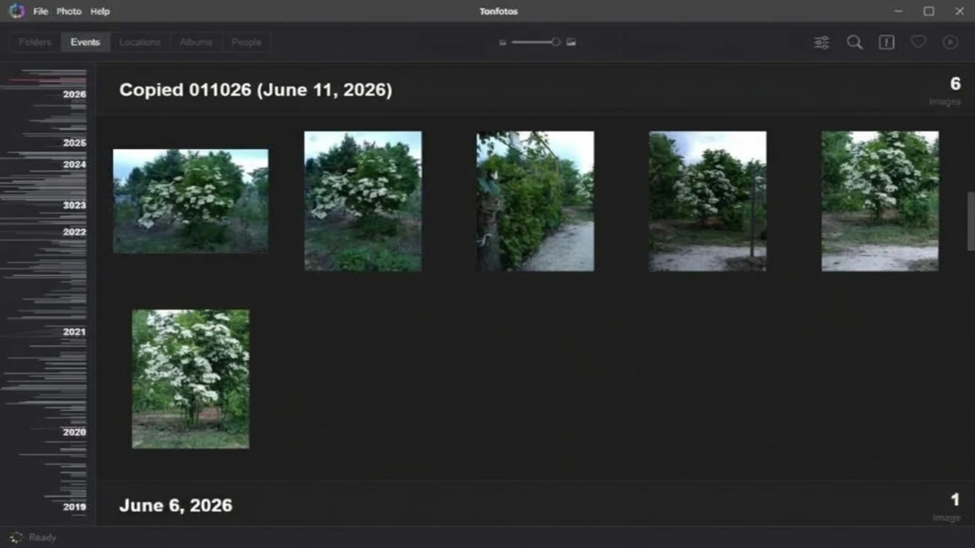 Tonfotos desktop application showing a timeline of organized photos categorized by events and dates.