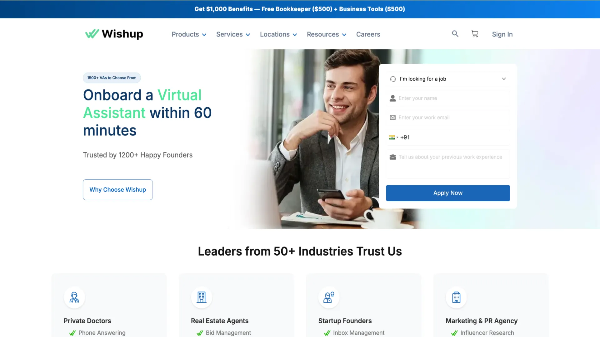 Wishup landing page offering fast virtual assistant onboarding in 60 minutes, featuring a professional man at a desk with a smartphone and sign-up form.